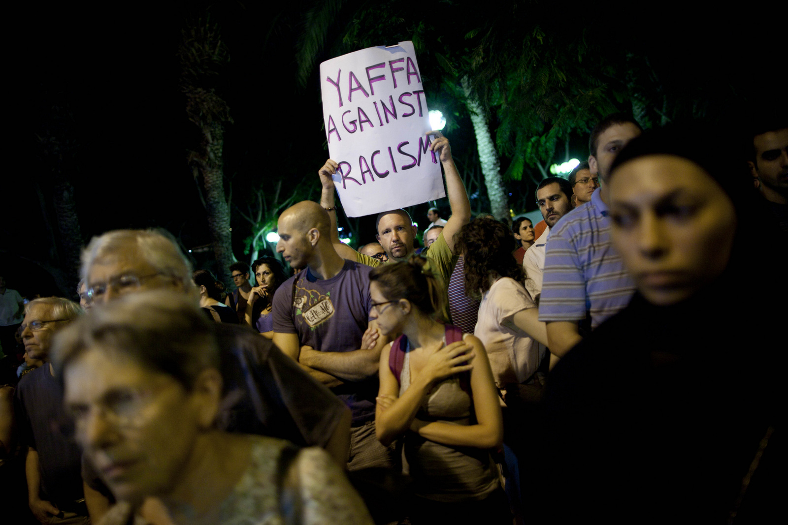 Israelis and Palestinians protest after two cemeteries, one Muslim and the other Christian, were vandalized by graffiti in the mixed Arab Jewish neighborhood of Jaffa, Israel,, Oct. 8, 2011. (AP/Oded Balilty)