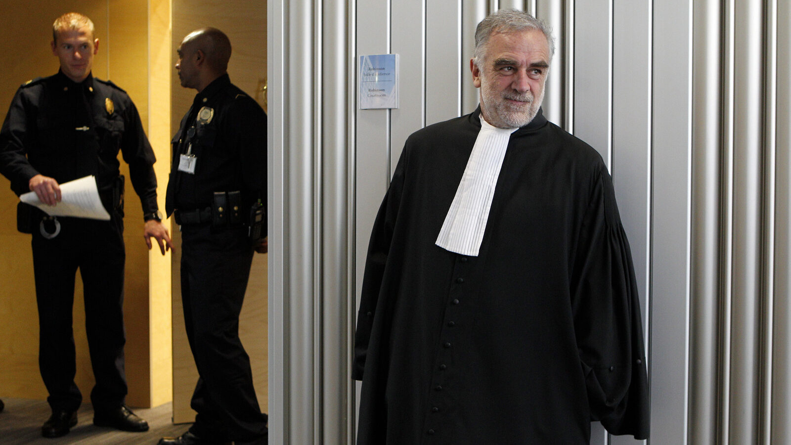 Luis Moreno-Ocampo leaves after a swearing-in ceremony at The International Criminal Court (ICC) in The Hague, Netherlands, Friday, June 15, 2012. (AP/Bas Czerwinski)