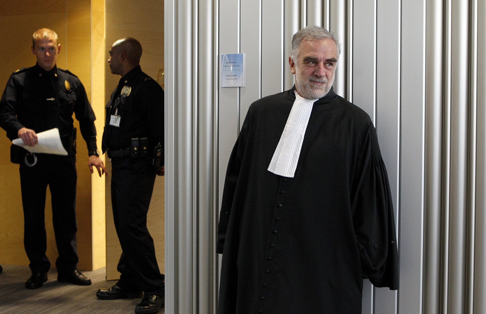 Luis Moreno-Ocampo leaves after a swearing-in ceremony at The International Criminal Court (ICC) in The Hague, Netherlands, Friday, June 15, 2012.  (AP/Bas Czerwinski)