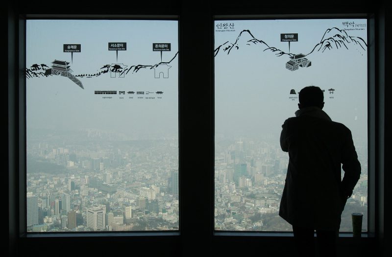 A man watches the Seoul skyline covered with a thick haze at Seoul Tower's observation deck in Seoul, South Korea. ( AP/Ahn Young-joon)