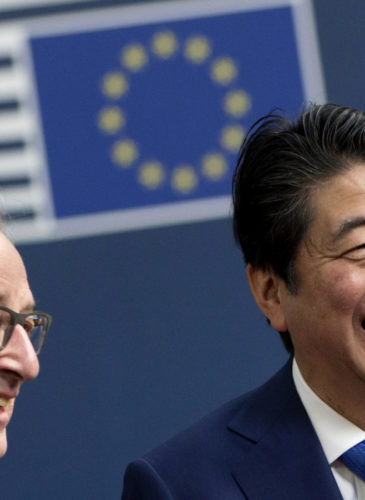 European Commission President Jean-Claude Juncker, left, greets Japanese Prime Minister Shinzo Abe on arrival at the Europa building in Brussels, March 21, 2017. (AP/Virginia Mayo)