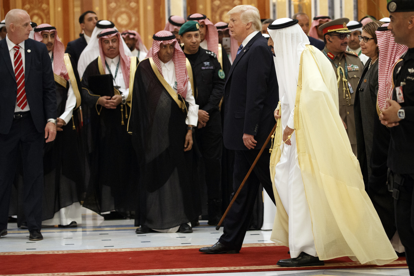 Saudi King Salman, second right, walks with US President Donald Trump to attend the Arab Islamic American Summit, at the King Abdulaziz Conference Center, May 21, 2017, in Riyadh, Saudi Arabia. (AP/Evan Vucci)