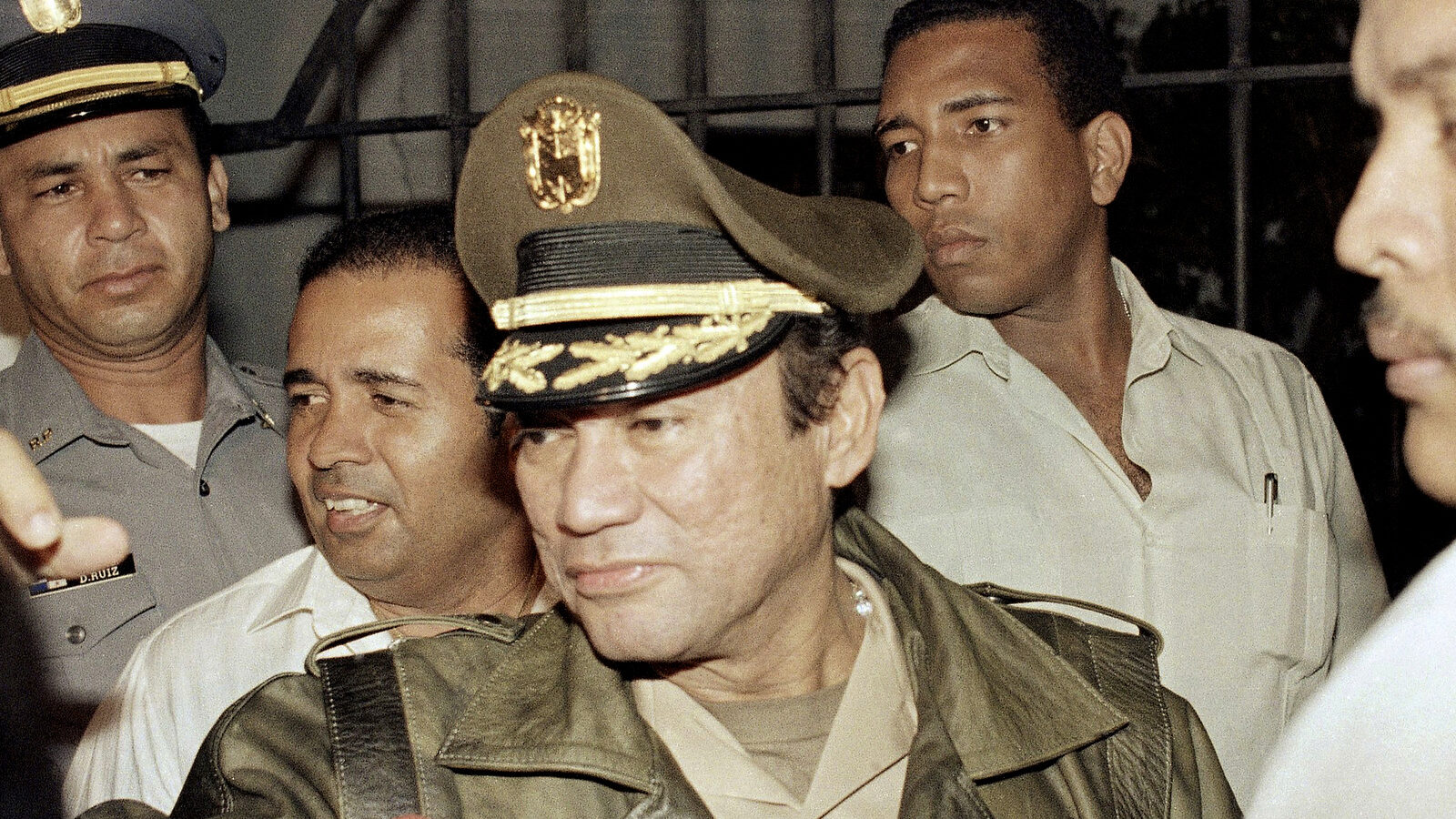 Manuel Antonio Noriega waves to supporters, in the presidential palace in Panama City. Noriega, a onetime U.S. asset who later was ousted by an American invasion in 1989, died late Monday, May 29, 2017, at age 83. (AP/John Hopper)