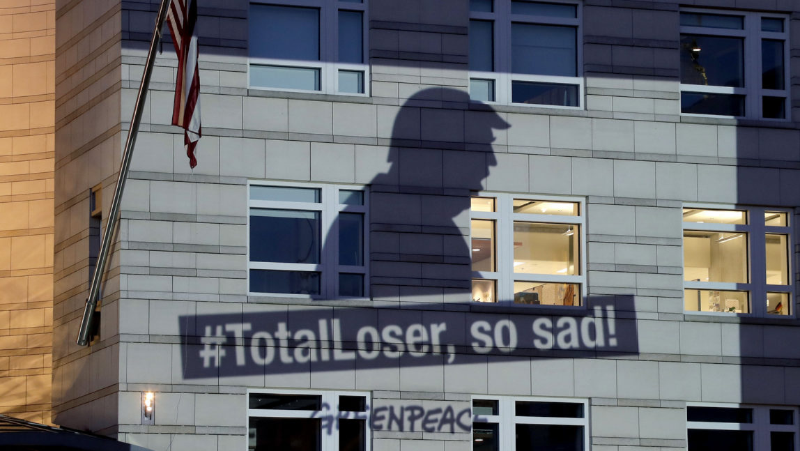 Banner showing Donald Trump and the slogan ‘#TotalLoser, so sad!’