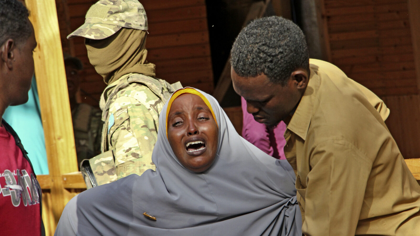 A mother whose daughter was shot in the head by attackers during a militant attack on a restaurant, grieves in Mogadishu, Somalia Thursday, June 15, 2017. Somalia's security forces early Thursday morning ended a night-long siege by the terrorist group al-Shabab at the popular "Pizza House" restaurant in the capital. (AP/Farah Abdi Warsameh)