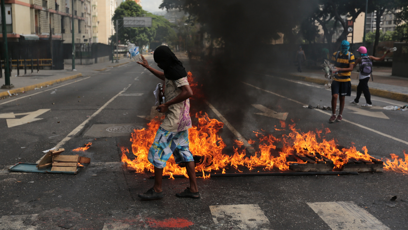 Anti-government protesters oversee a burning barricade in Caracas, Venezuela, June 26, 2017. (AP/Fernando Llano)