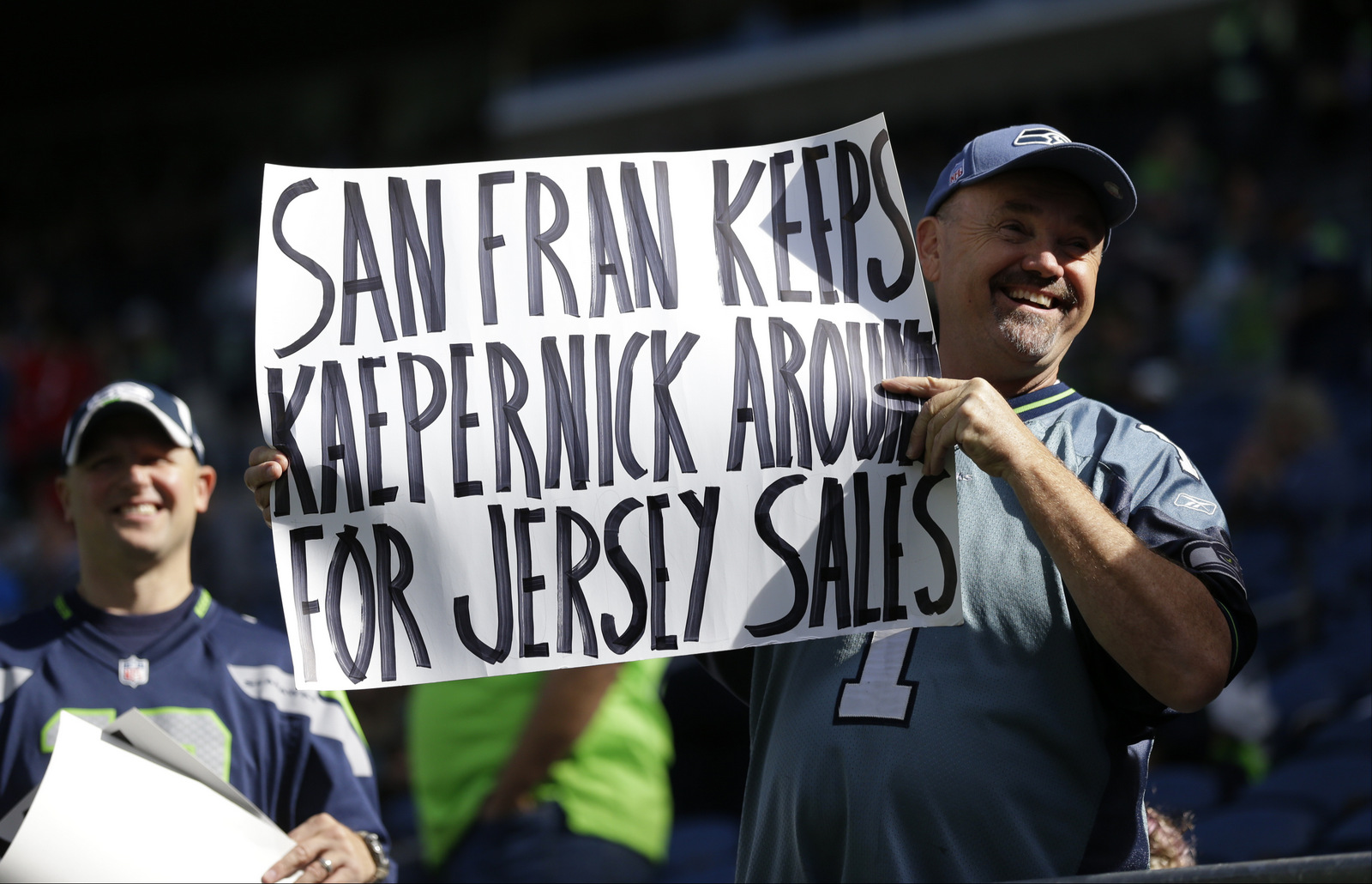 A Seattle Seahawks fan holds up a sign mocking Colin Kaepernick before an NFL game, Sept. 25, 2016, in Seattle. (AP/Ted S. Warren)