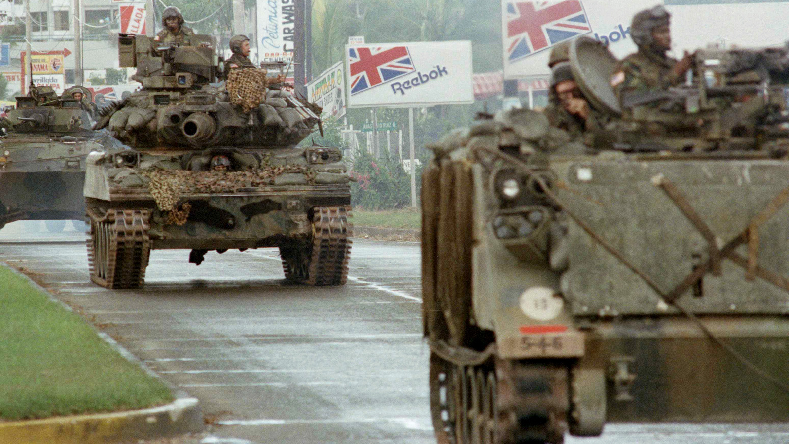 U.S. tanks and armed personal carrier transiting in Panama through the Balboa Avenue, Thursday, Dec. 21, 1989 in Panama City, taking places all over the city to stop the looting and the confrontation between the US troops and forces of Gen. Noriega. (AP/Jaime Fernandez)