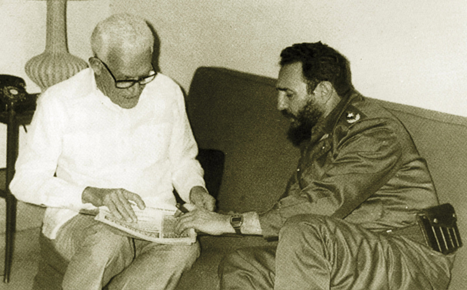 Former Dominican President Juan Bosch, left, speaks with Cuban President Fidel Castro in Havana, Cuba. (AP Photo)