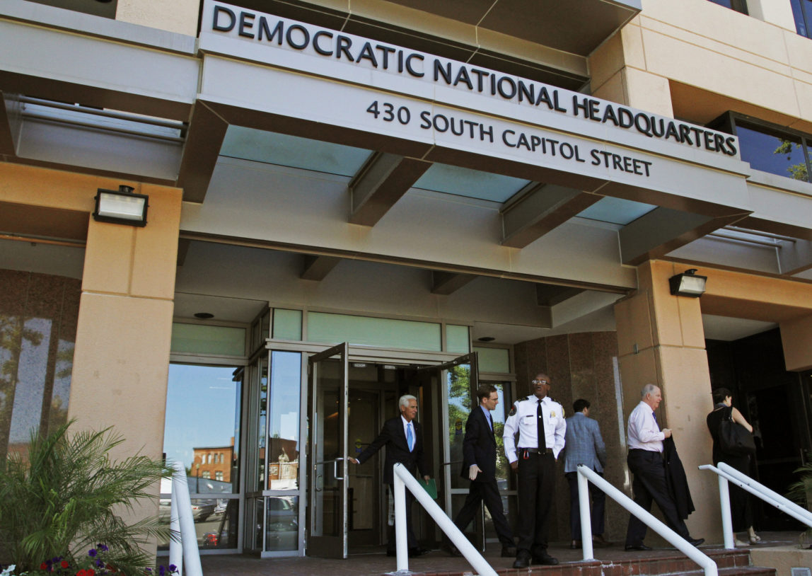 People stand outside the Democratic National Committee (DNC) headquarters in Washington (AP/Paul Holston)
