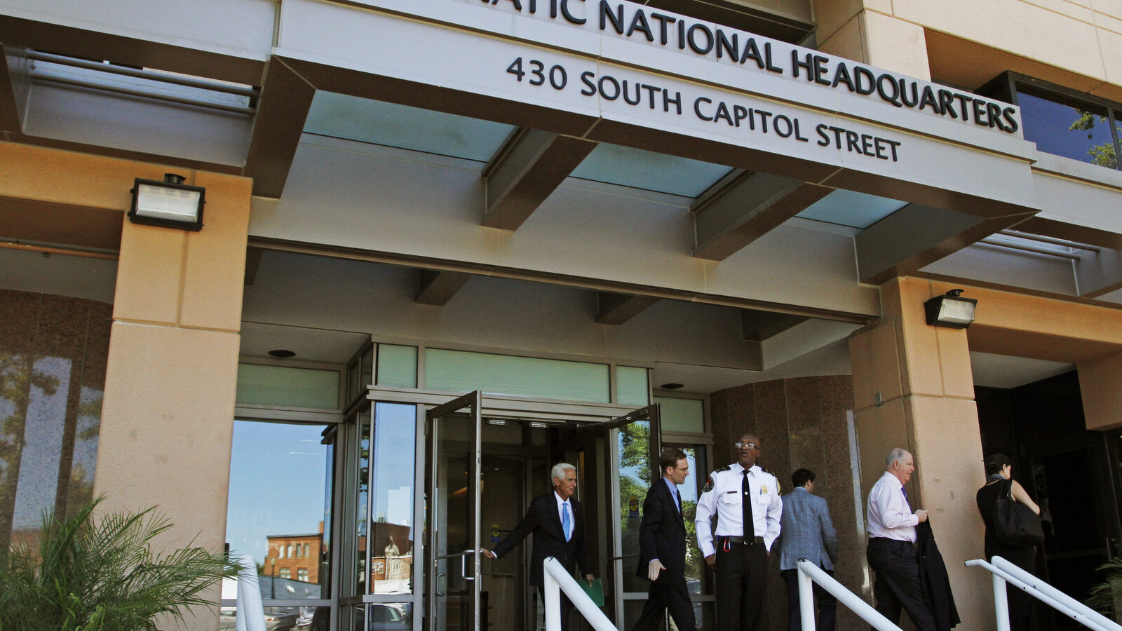 People stand outside the Democratic National Committee (DNC) headquarters in Washington (AP/Paul Holston)