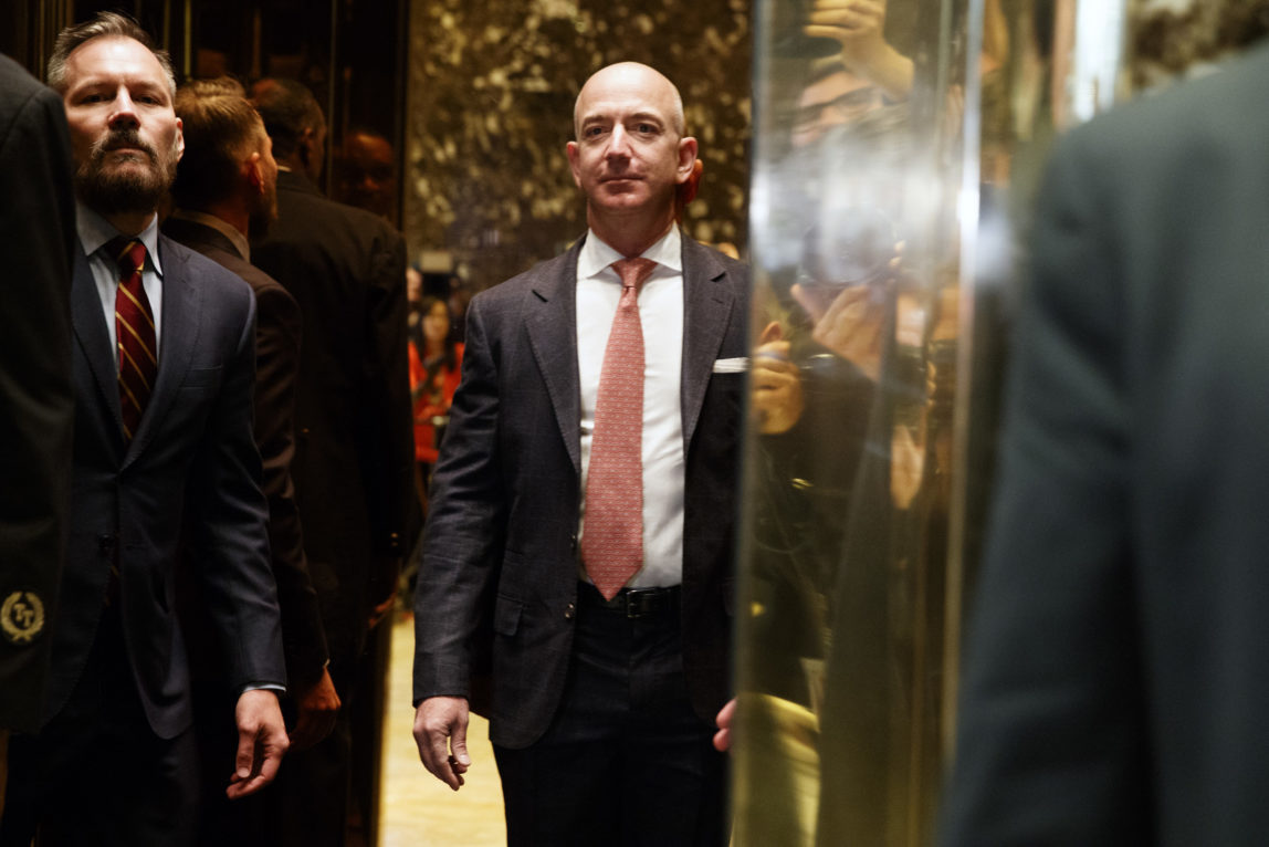 Amazon CEO and Wahsington Post owner, Jeff Bezos on an elevator for a meeting with then President-elect Donald Trump at Trump Tower in New York, Dec. 14, 2016. (AP/Evan Vucci)