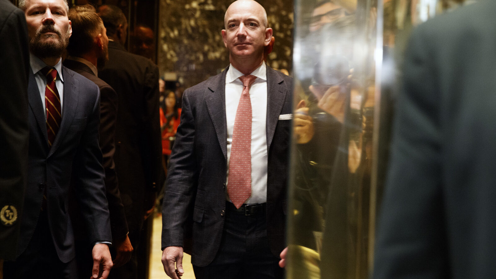 Amazon CEO and Wahsington Post owner, Jeff Bezos on an elevator for a meeting with then President-elect Donald Trump at Trump Tower in New York, Dec. 14, 2016. (AP/Evan Vucci)