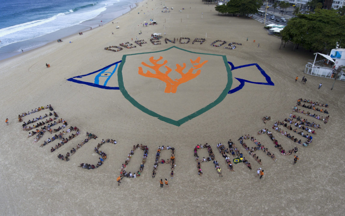 People stand together to spell out a message that reads in Portuguese: "Defend the Amazon coral reef", on Copacabana beach in Rio de Janeiro, Brazil, March 29, 2017. The event is a protest organized by the non-governmental environmental group Greenpeace against announced plans to explore for oil in the Amazon River Basin. (AP/Mario Lobao)