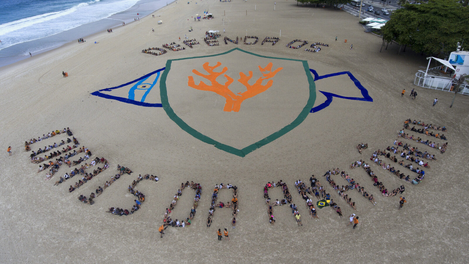 People stand together to spell out a message that reads in Portuguese: "Defend the Amazon coral reef", on Copacabana beach in Rio de Janeiro, Brazil, March 29, 2017. The event is a protest organized by the non-governmental environmental group Greenpeace against announced plans to explore for oil in the Amazon River Basin. (AP/Mario Lobao)