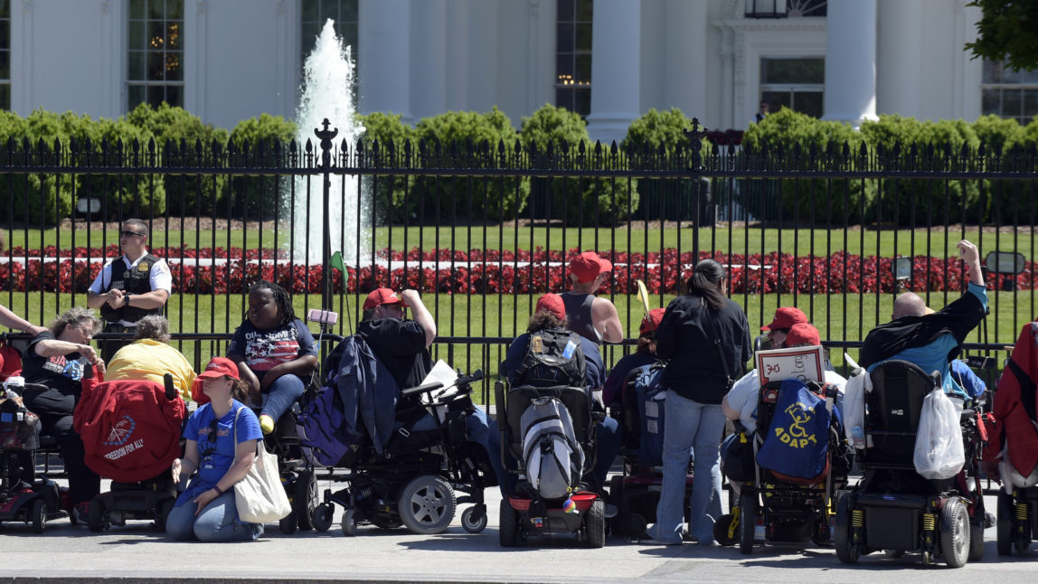 Protesters supporting people with disabilities gather outside the White House in Washington, May 15, 2017. (AP Photo/Susan Walsh)