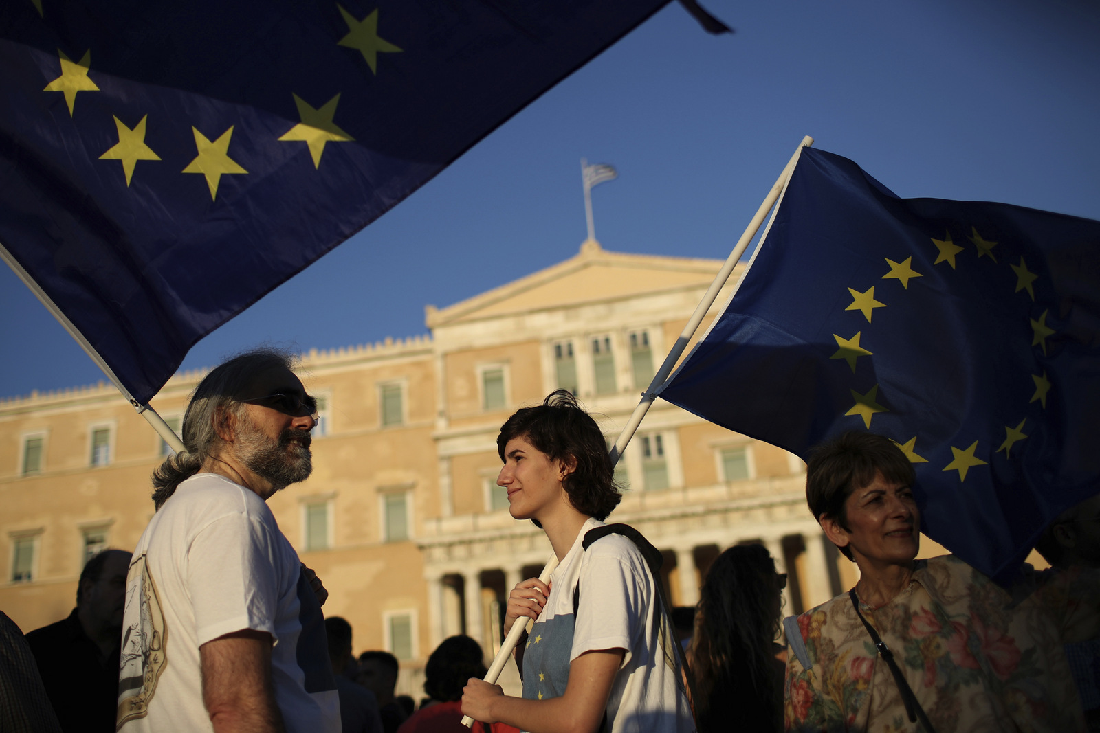 Greek Protesters hold European flags during an anti government rally outside the Greek parliament, central Athens, June 20 , 2017. (AP/Petros Giannakouris)