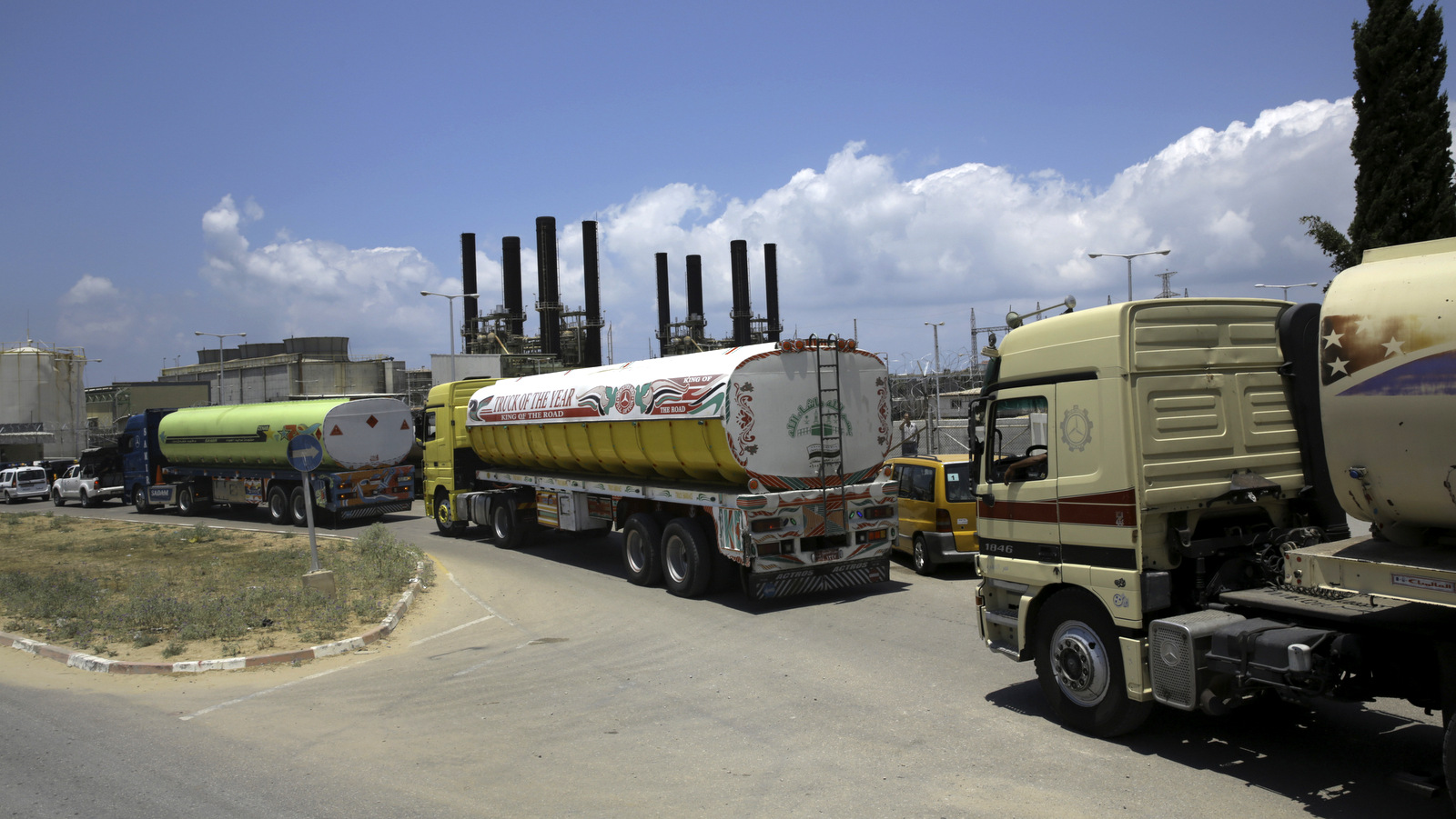 Egyptian trucks carrying fuel enter Gaza's power plant in Nusseirat, in the central Gaza Strip, Wednesday, June 21, 2017. Egypt trucked 1 million liters of cheap diesel fuel to the Gaza Strip's sole power plant — a rare shipment that temporarily eased a crippling electricity crisis enclave but also appeared to undercut Palestinian President Mahmoud Abbas. (AP/Adel Hana)