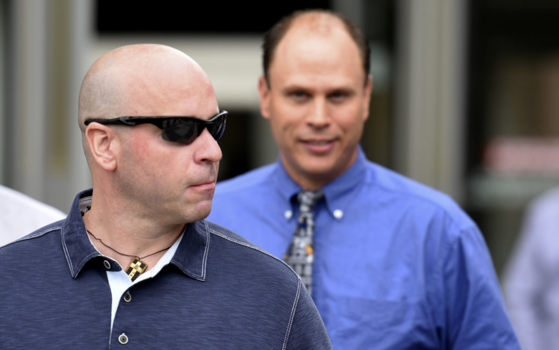 Former Chicago police officer Joseph Walsh, left, and Chicago police officer Thomas Gaffney, right, depart the Cook County Courthouse after their arraignment on state felony charges of conspiracy in the investigation of the 2014 shooting death of Laquan McDonald, July 10, 2017, in Chicago. (AP/G-Jun Yam)