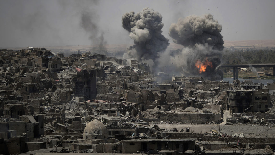 Airstrikes target ISIS positions on the edge of the Old City a day after Iraq's prime minister declared "total victory" in Mosul, Iraq, July 11, 2017. (AP/Felipe Dana)