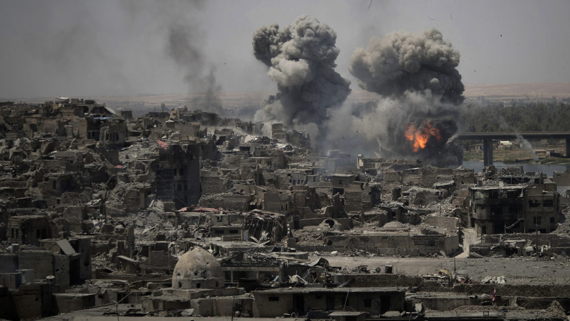 Airstrikes target ISIS positions on the edge of the Old City a day after Iraq's prime minister declared "total victory" in Mosul, Iraq, July 11, 2017. (AP/Felipe Dana)