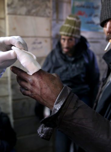 An addict receives treatment at a drop-in center and shelter south of Tehran, Iran. (AP/Ebrahim Noroozi)