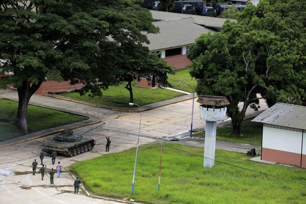 Soldiers patrol inside the Paramacay military base in Valencia, Venezuela, Sunday, Aug. 6, 2017. Earlier in the day, troops quickly put down an attack at the army base on Sunday, clashing with a group that said it was out to re-establish the constitutional order but was dismissed by officials as a band of civilians working with a deserted lieutenant and a former officer. (AP/Juan Carlos Hernandez)