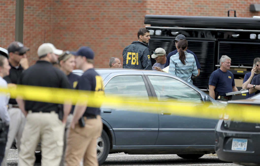 Law enforcement officials investigate an explosion at the Dar Al-Farooq Islamic Center in Bloomington, Minn., on Saturday, Aug. 5, 2017. (David Joles/Star Tribune)