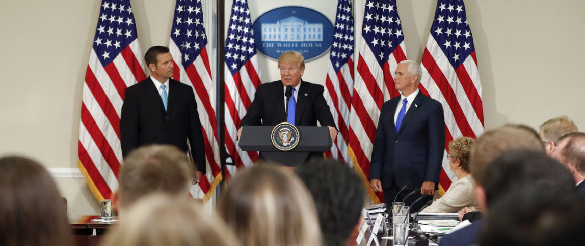 President Donald Trump, with Kansas Secretary of State Kris Kobach, left, and Vice President Mike Pence, in Washington. (AP/Pablo Martinez Monsivais)