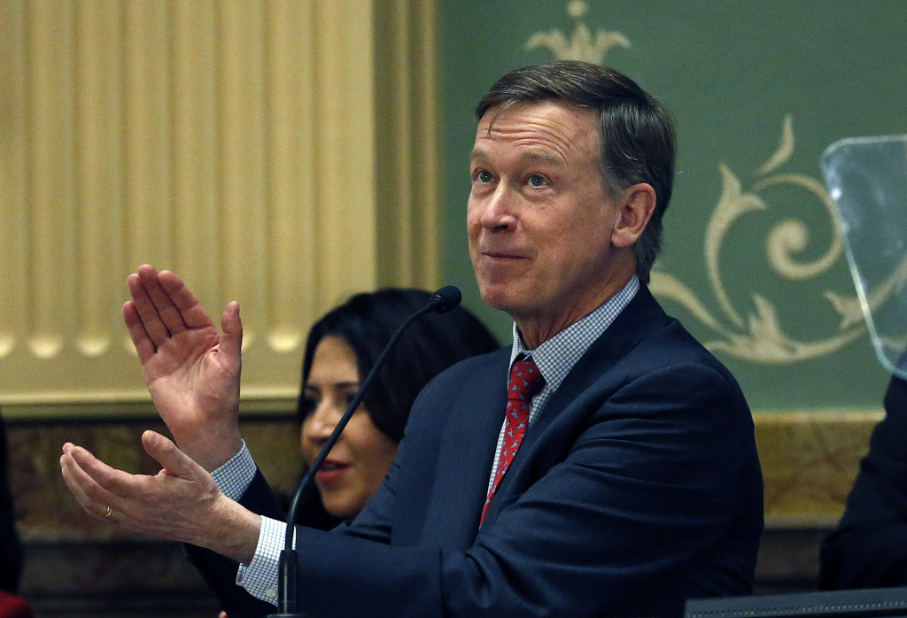 Colorado Gov. John Hickenlooper applauds as he delivers his annual State of the State address in Denver. Dissatisfied with Democratic fortunes in the Trump era, a group of prominent Democrats is forming an organization outside the formal party structure with the goal of winning again in Republican-dominated middle America. Calling itself “New Democracy.” (AP/Brennan Linsley)