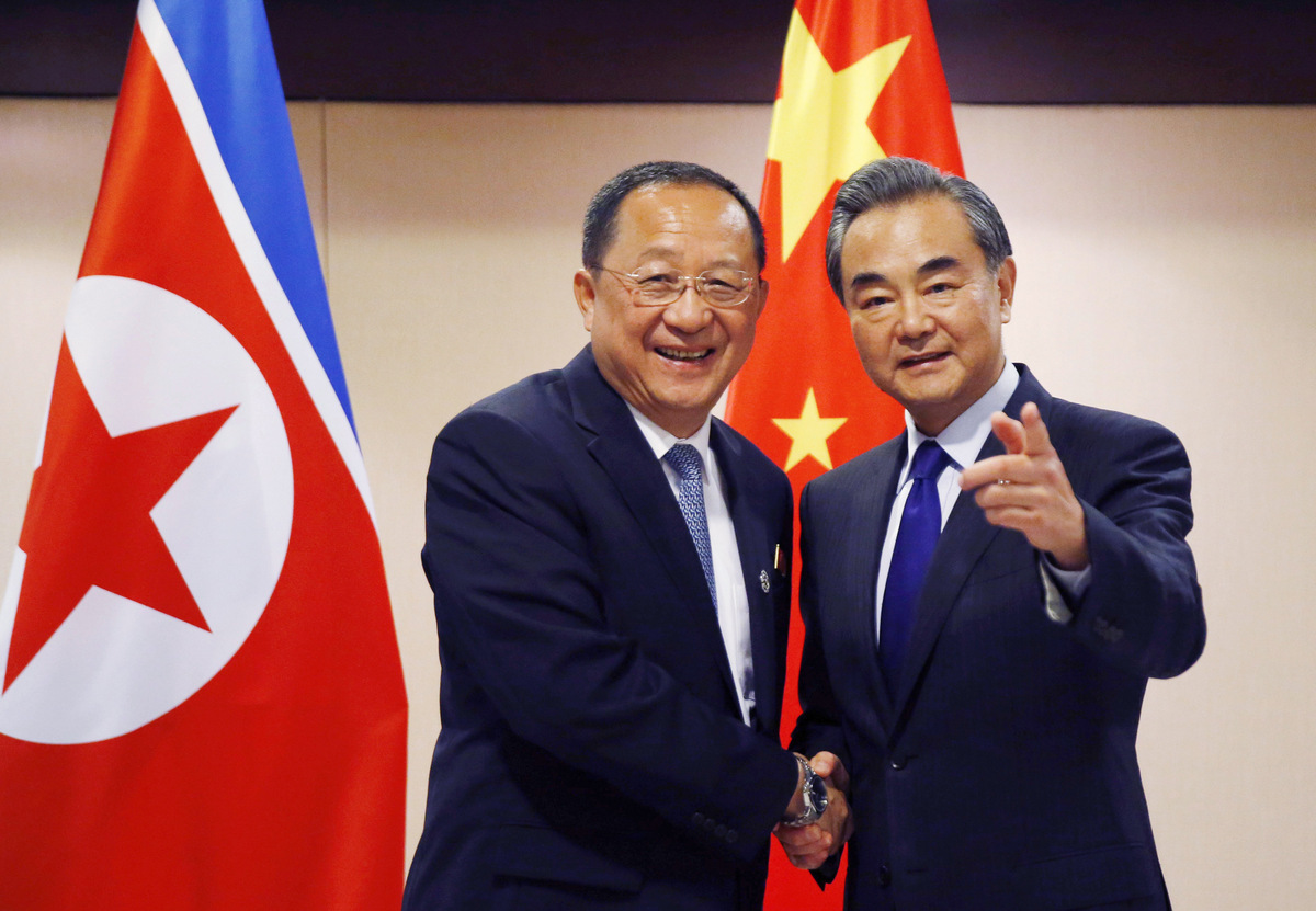 North Korean Foreign Minister Ri Yong Ho, left, is greeted by his Chinese counterpart Wang Yi in Manila, Philippines, Aug. 6, 2017. (AP/Bullit Marquez)