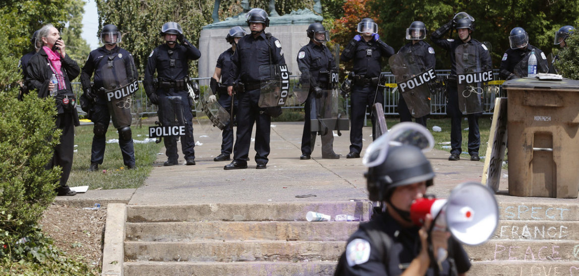 State Police in riot gear guard Lee Park after a white nationalist demonstration was declared illegal and the park was cleared in Charlottesville, Va., Aug. 12, 2017. (AP/Steve Helber)