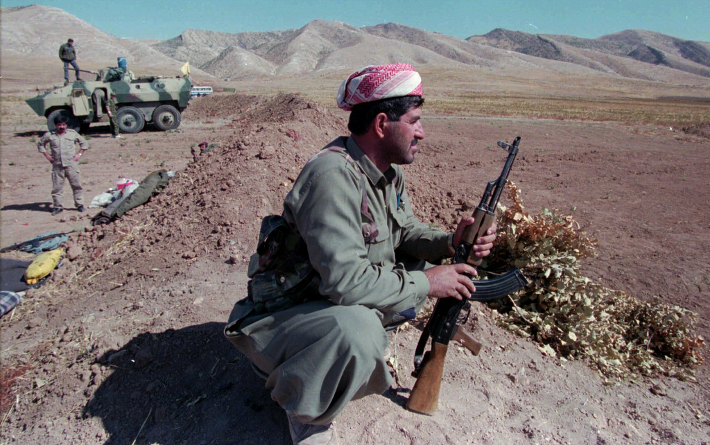 A Kurdistan separatist fighter waits at his position near Degala, Iraq. Oct. 16, 1996 during fighting between rival Kurdish factions. (AP/Burhan Ozbilici)
