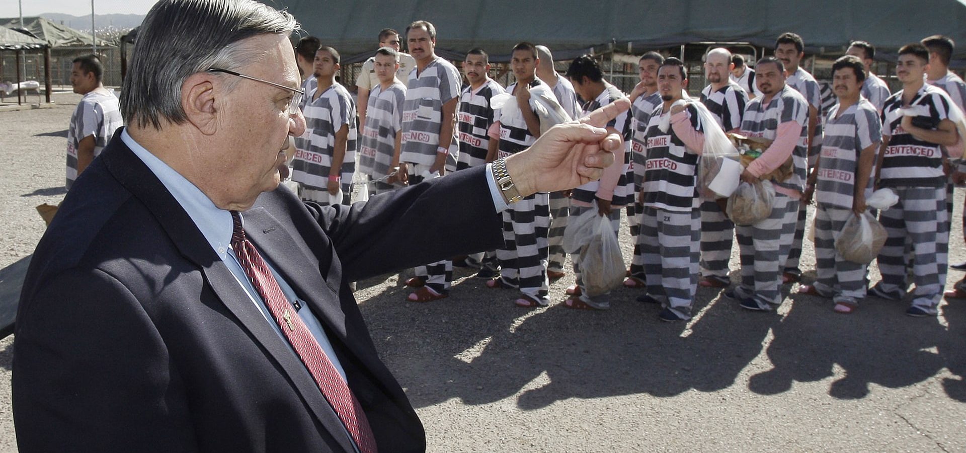 Joe Arpaio, who proclaimed himself ‘America’s toughest sheriff’, showing detainees at the Tent City facility to the media in 2009. (Photo: Ross D. Franklin/AP)