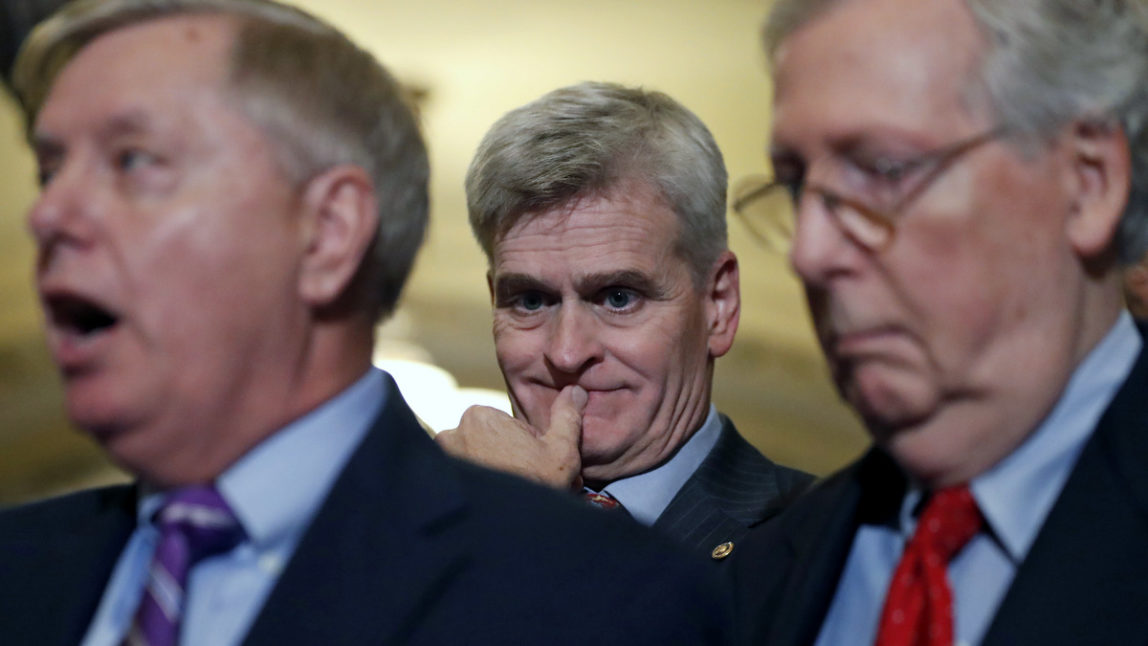 Sen. Bill Cassidy, R-La., center, listens as Sen. Lindsey Graham, R-S.C., left, speaks, accompanied by Senate Majority Leader Mitch McConnell of Ky., on Capitol Hill, Tuesday, Sept. 19, 2017 in Washington. (AP/Alex Brandon)