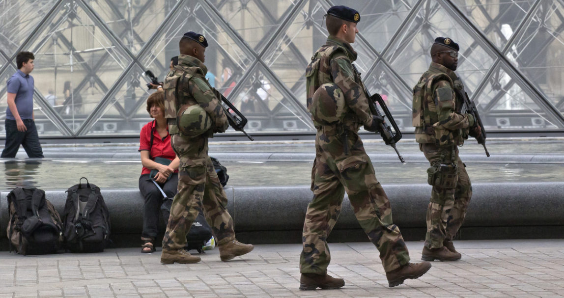 French soldiers patrol by the glass pyramid at the Louvre museum in Paris, Thursday, Aug. 18, 2016. France has been under a state of emergency since November, 2015. (AP/Michel Euler)