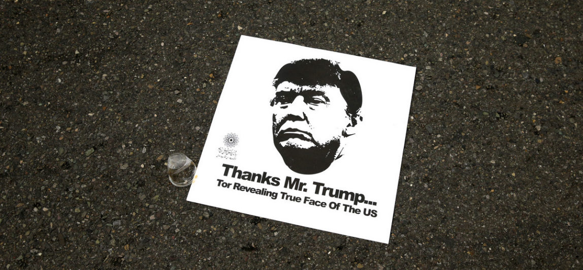 A poster on the street with a portrait of U.S. President Donald Trump and a sentence referring to a quotation of Iranian Supreme Leader Ayatollah Ali Khamenei, in an annual rally commemorating the anniversary of the 1979 Islamic revolution, which toppled the late pro-U.S. Shah, Mohammad Reza Pahlavi, in Tehran, Iran, Feb. 10, 2017. (AP/Vahid Salemi)