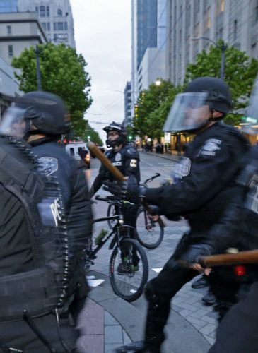 Seattle Police officers move in to make an arrest, Monday, May 1, 2017, during a May Day protest in Seattle. (AP/Ted S. Warren)