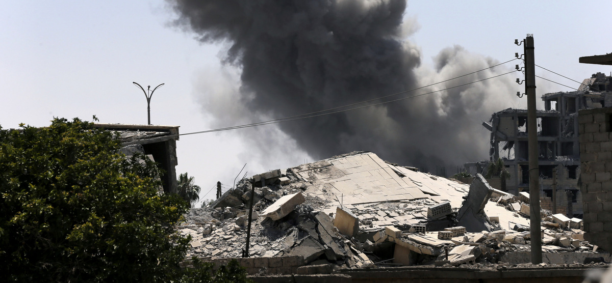 Black smoke rises from a US airstrike on the eastern side of Raqqa, Syria, July 26, 2017. (AP/Hussein Malla)