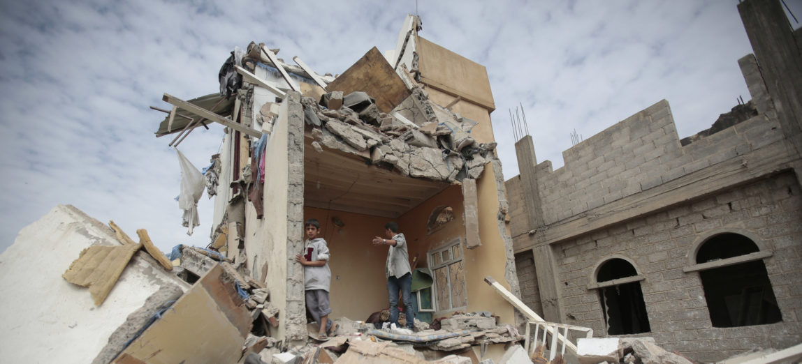 Boys stand on the rubble of a house destroyed by Saudi-led airstrikes in Sanaa, Yemen, Friday, Aug. 25, 2017. Airstrikes by a Saudi-led coalition targeted Yemen's capital early on Friday, hitting at least three houses in Sanaa and killing at least 14 civilians, including women and children, residents and eyewitnesses said. (AP Photo/Hani Mohammed)