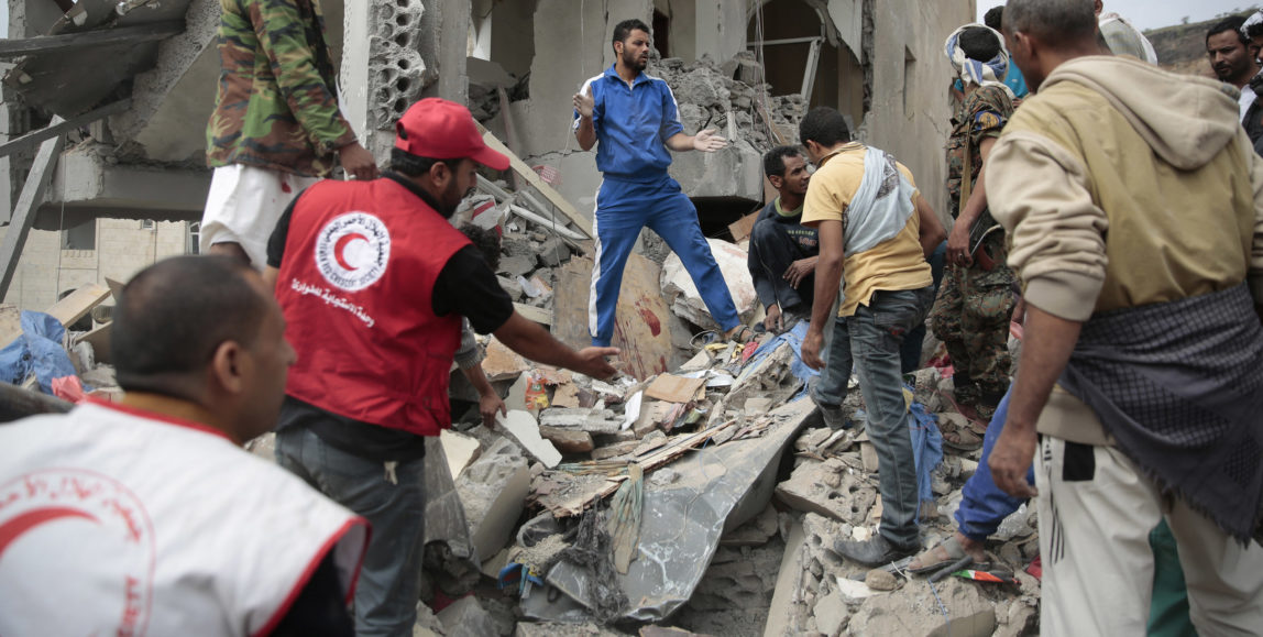 People search under the rubble of houses destroyed by Saudi-led airstrikes in Sanaa, Yemen, Friday, Aug. 25, 2017. The airstrikes by the Saudi-led coalition targeted Yemen's capital early on Friday, hitting at least three houses in Sanaa and killing at least 14 civilians, including women and children, residents and eyewitnesses said. (AP Photo/Hani Mohammed)