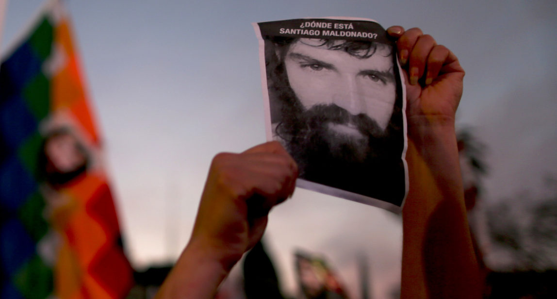 Demonstrators hold photos of missing activist Santiago Maldonado, during a protest at Plaza de Mayo in Buenos Aires, Argentina, Friday, Sept. 1, 2017. Human rights groups say Maldonado went missing a month ago today, after Argentine border police captured him during an operation against Mapuche Indians who were blocking a highway in Argentina's Patagonia. (AP Photo/Natacha Pisarenko)