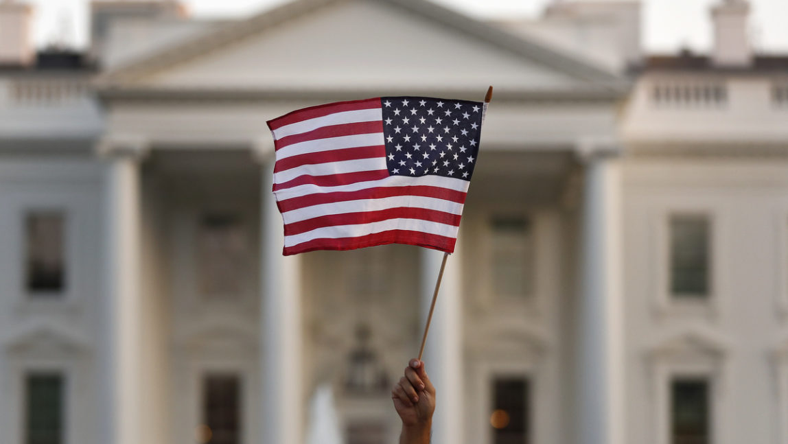 A supporter of the Deferred Action for Childhood Arrivals, or DACA, waves a flag during a rally outside the White House, in Washington, Monday, Sept. 4, 2017. A plan President Donald Trump is expected to announce Tuesday for young immigrants brought to the country illegally as children was embraced by some top Republicans on Monday and denounced by others as the beginning of a "civil war" within the party. (AP Photo/Carolyn Kaster)