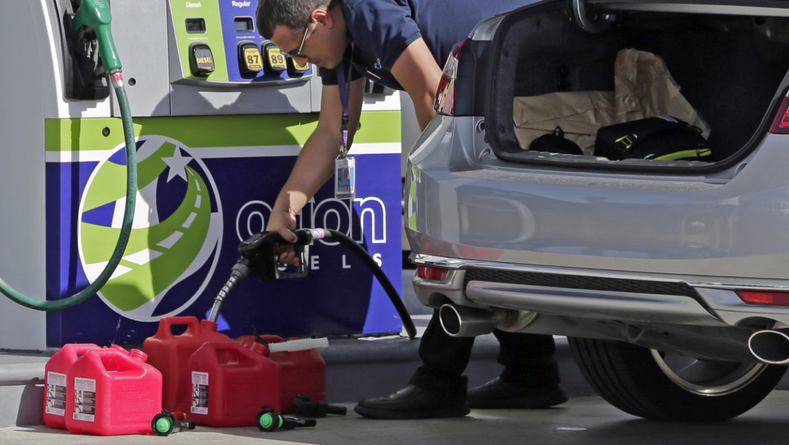 A motorist fills up containers with gas as he prepares for Hurricane Irma, Sept. 7, 2017, in Miami. South Florida officials are expanding evacuation orders as Hurricane Irma approaches, telling more than a half-million people to seek safety inland. (AP/Alan Diaz)