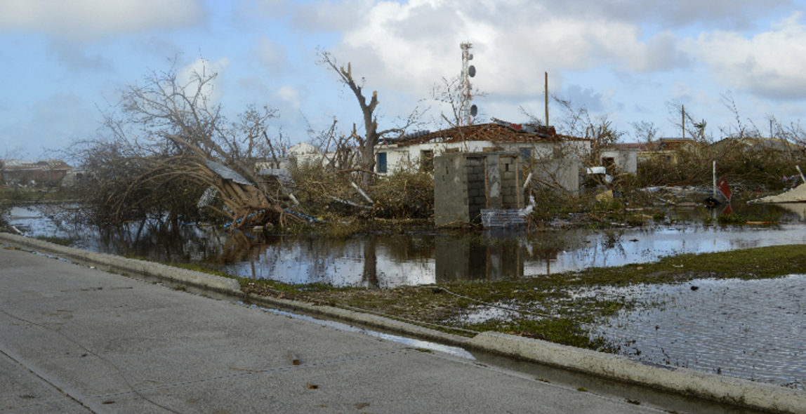 In this Thursday, Sept. 7, 2017, photo, damage is left after Hurricane Irma hit Barbuda. Hurricane Irma battered the Turks and Caicos Islands early Friday as the fearsome Category 5 storm continued a rampage through the Caribbean that has killed a number of people, with Florida in its sights. (AP/Anika E. Kentish)
