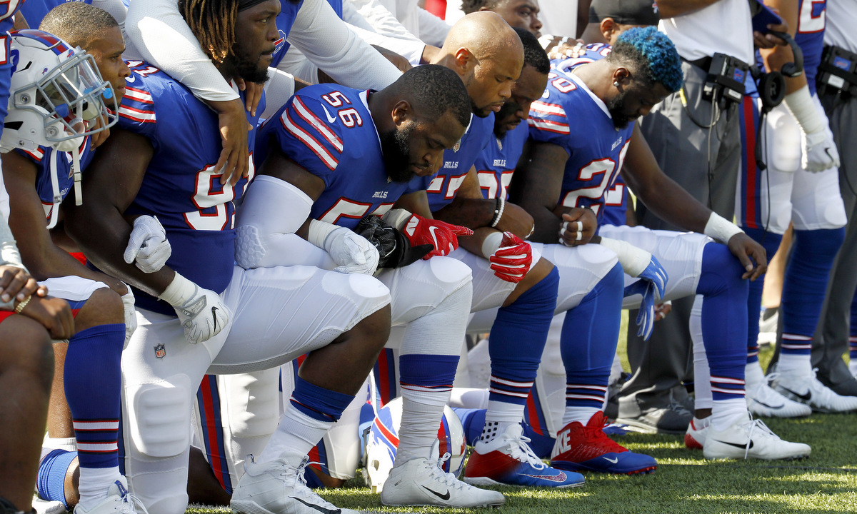 Buffalo Bills players kneel during the national anthem prior to an NFL football game against the Denver Broncos, Sunday, Sept. 24, 2017, in Orchard Park, N.Y. (AP Photo/Jeffrey T. Barnes)