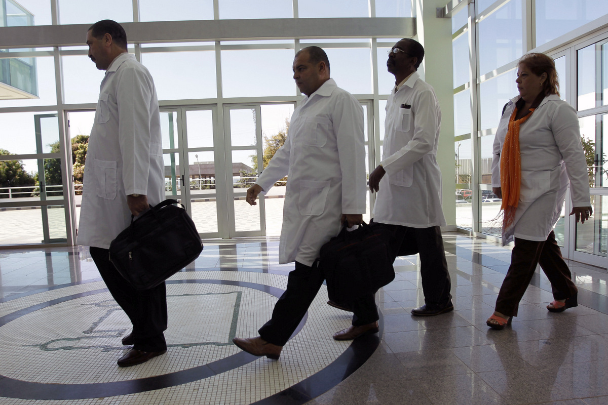Cuban doctors arrive for training before being assigned to work in impoverished areas where physicians and medical services are scarce, at the University of Brasilia in Brasilia, Brazil, Aug. 26, 2013. (AP/Eraldo Peres)