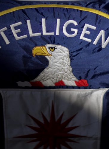 The Central Intelligence Agency flag is displayed, partially cast in a shadow. (AP Photo/David Goldman)