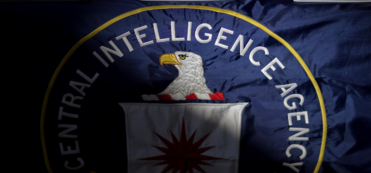 The Central Intelligence Agency flag is displayed, partially cast in a shadow. (AP Photo/David Goldman)