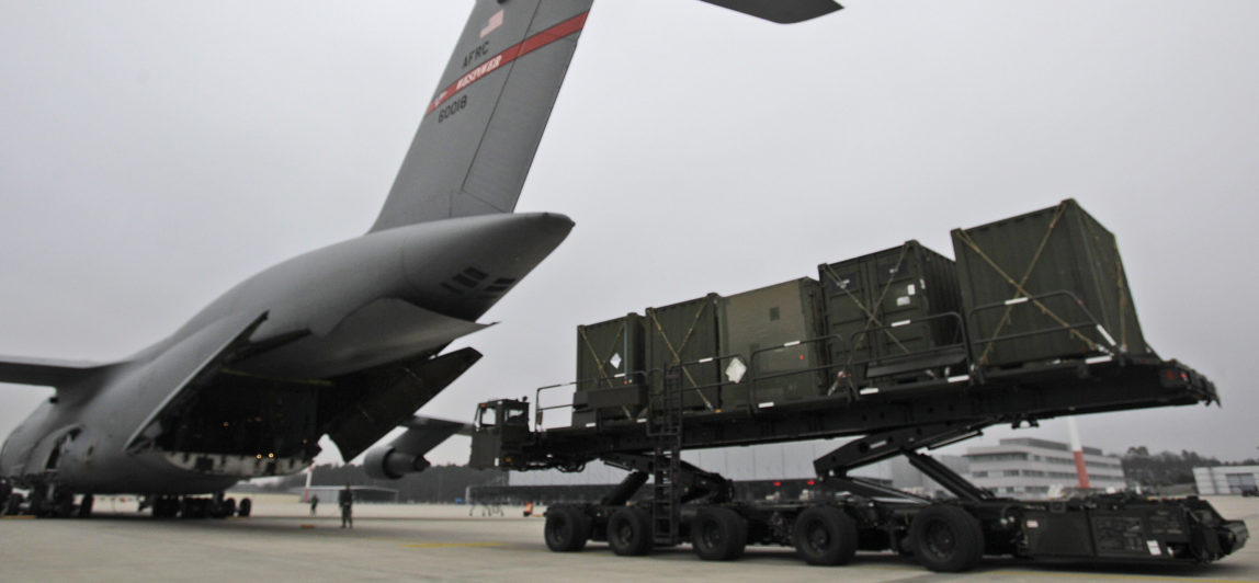 US Air Force airmen load cargo of the 10th Army Air and Missile Defense Command for deploying to Turkey at the US Air Base in Ramstein, Germany, Jan. 8, 2013. (AP Photo/Frank Augstein)